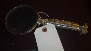 A silver plated novelty magnifying glass