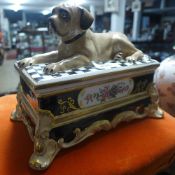 A pottery trinket box with dog finial, s
