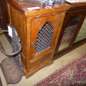 A teak and wrought iron lattice work pan