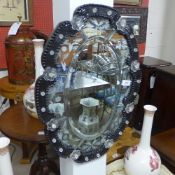 A Venetian style undulating pier mirror