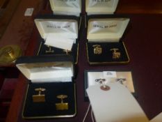 A collection of five cufflinks including