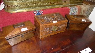 Two tea caddies and a carved orientalist