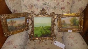 A plaque in gilded frame and a pair of o
