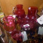 A collection of cranberry glass includin