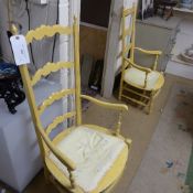 Two ochre painted ladder back open armch