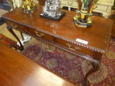 A Chippendale mahogany library table the gadrooned edge with drawers opposing dummy drawers on