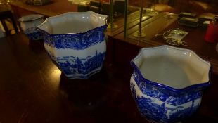 A graduated set of three blue and white