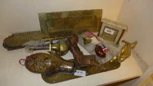 A collection of brass door plates, knockers and others