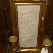 A reconstituted marble plaque depicting