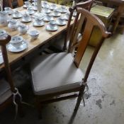 A set of six fruitwood Chinese style dining chairs with pad seat