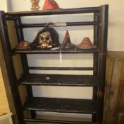 An ebonised three tiered bamboo bookcase with open shelves