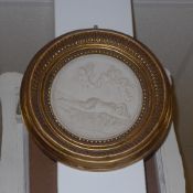 A reconstituted marble circular plaque d