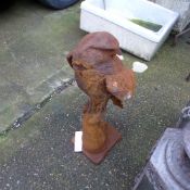 A cast iron garden statue of an eagle