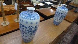 A pair of large Chinese vases with flora
