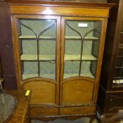 An Edwardian inlaid mahogany display cab