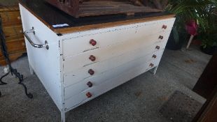 A white painted plan chest with five drawers
