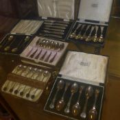 A collection of silver plated boxed spoo