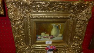 An oil on board still life water jug and