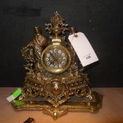 A heavy brass mantle clock with classica