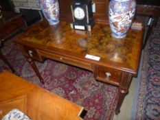A late Victorian walnut desk the cross b