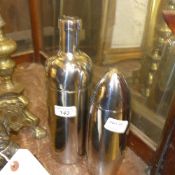 Two chrome cocktail shakers both in mode