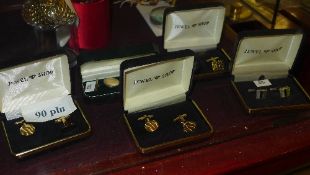 A collection of four cased cufflinks inc