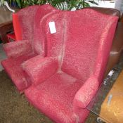 A pair of C20th mahogany wingback armchairs (a/f)
