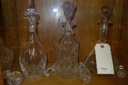 A collection of cut glass decanters