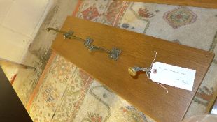 A Gothic revival brass and oak coat rack