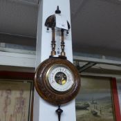 An early C20th enamel mounted barometer