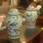 A pair of Chinese porcelain temple vases and covers with Kylin decoration