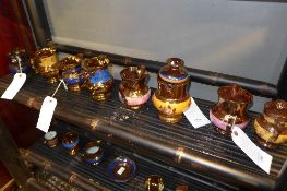 A large collection of lustre jugs of the
