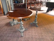 *2 Circular Bar Tables with Cast Iron Bases on Hard Wood Tops