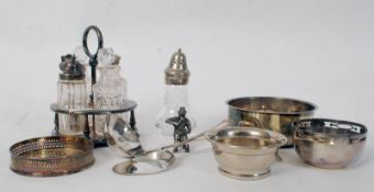 A  good selection of silver plated wares to include wine coasters, a cut glass and silver plated