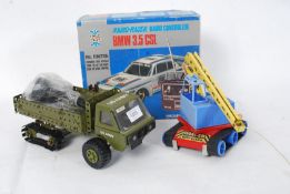 A retro remote controlled boxed Taiyo BMW, Meccano army truck and a retro Tonka toy