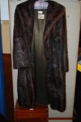 A good mid 20th century ladies Musquash fur coat having lined interior