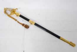 A 20th century US Naval Officer's Sword by Wolf-Brown. The stainless steel b lade is finely etched