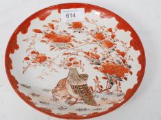 A 19th century Japanese Satsuma plate being signed to the verso by the artist. The decoration of