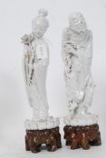 2 19th century Chinese glazed figures being raised over pierced wooden socles