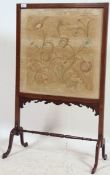 A good Edwardian mahogany fire screen raised on turned legs united by stretchers. The inset silkworm