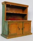 A good early 19th century apprentice piece kitchen dresser being later painted shabby chic. The