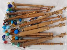 A small collection of lace bobbins all with glass beads