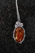 A white metal 925 silver and amber drop pendant necklace