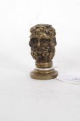 A vintage style brass letter / document seal in the form of a bearded man.