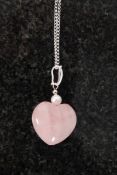 A white metal 925 silver and rose quartz heart shaped pendant necklace.  Weight 13.1 grams. R
