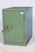 A  20th century metal Industrial locker in green having full length doors with shelved interior.
