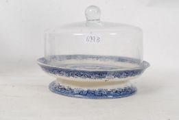 A N&D of Longton, Staffordshire blue and white raised dish having later glass cloche atop