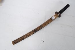 A Japanese officers wakizashi (short sword), believed 19th Century having single edge blade, the