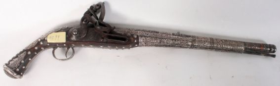A 19th century 16 bore Blakan long barrel flintlock pistol The tapering barrel being silver