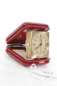 A decorative early 20th century Art Deco travel alarm clock complete in the original case